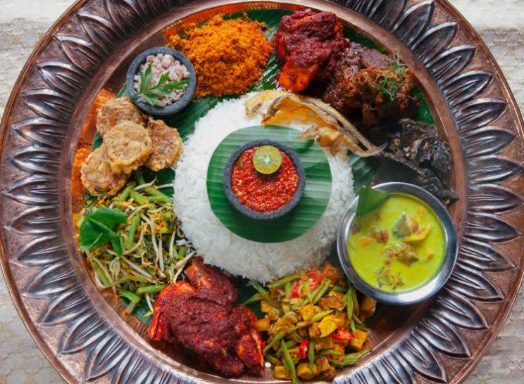 Some of Mamanda’s signature dishes include the Nasi Ambeng, a popular Malay rice dish typically served with a variety of side dishes and gravy such as rendang, sambal goreng and serunding. (Photo: Mamanda Restaurant)