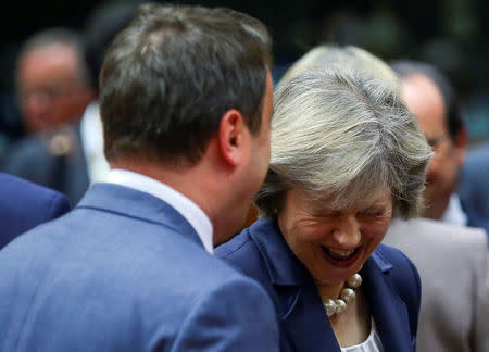 Luxembourg's Prime Minister Xavier Bettel and Prime Minister Theresa May attend a European Union leaders summit in Brussels, Belgium October 20, 2016. REUTERS/Yves Herman