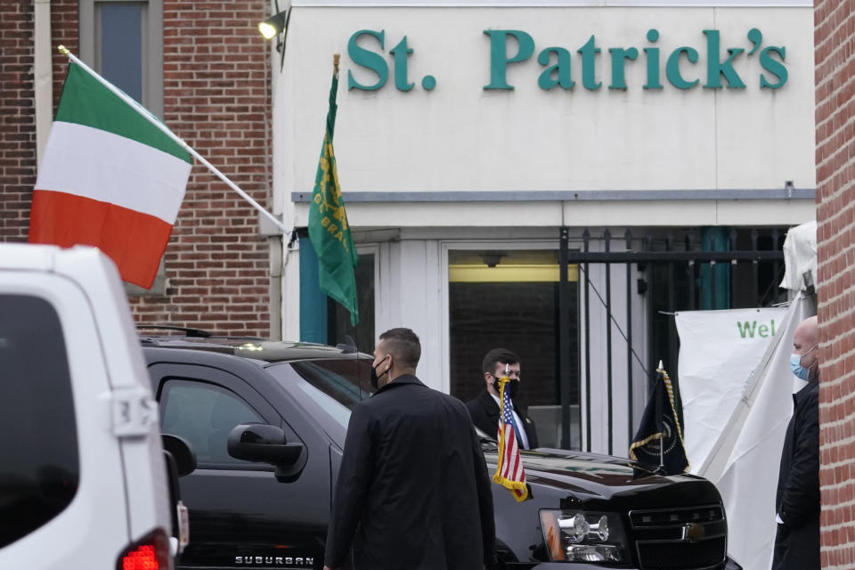 President Joe Biden's security detail waits for his departure as he attends mass at St. Patrick's Catholic Church in Wilmington, Del., Wednesday, March 17, 2021, on St. Patrick's Day. (AP Photo/Carolyn Kaster)