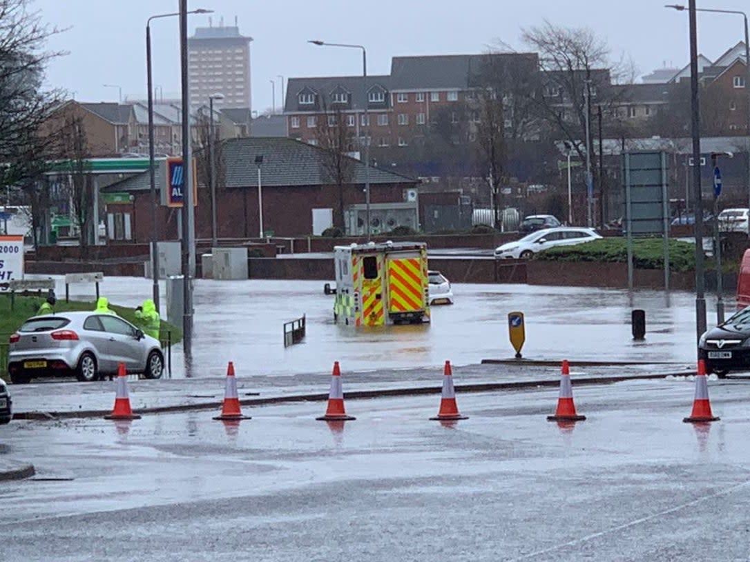 An ambulance stuck in flooding in Paisley, Scotland: Andrew Blane/PA Wire