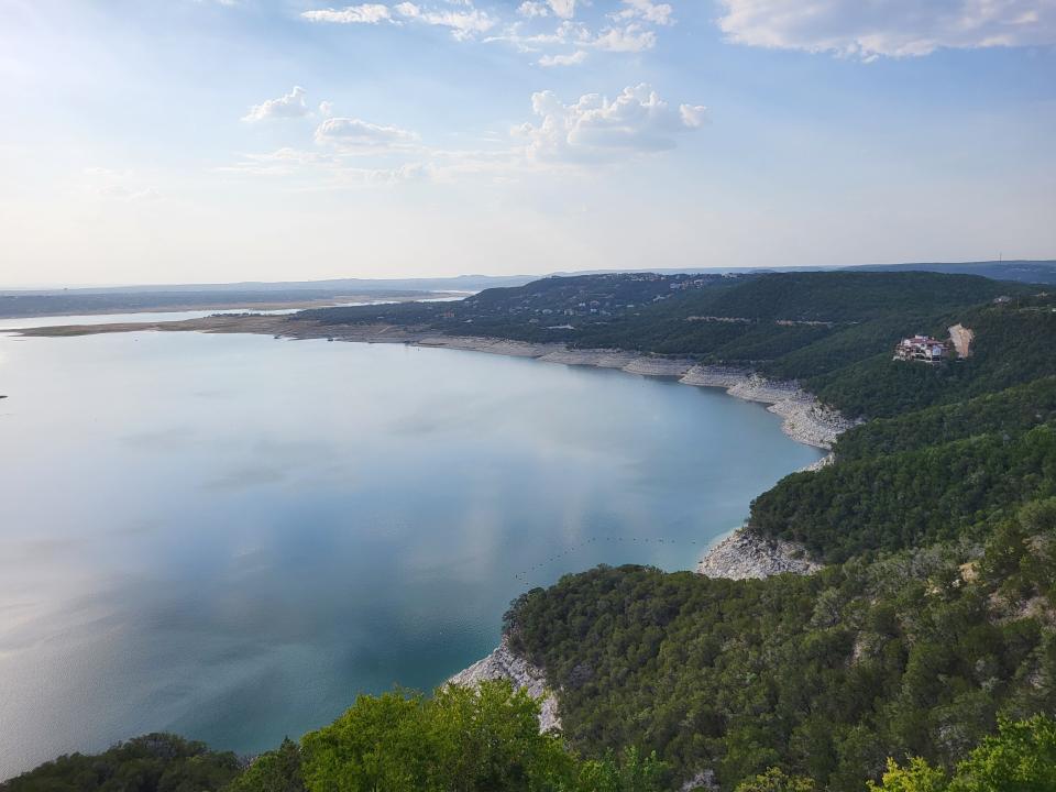 From the shoreline of Lake Travis, the substantial drop in lake level is evident.