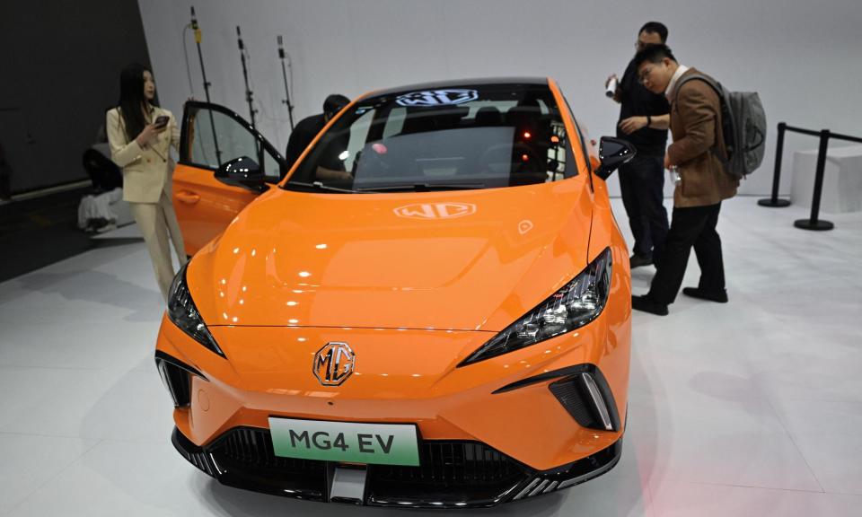 <span>The MG 4 EV electric sports car on display at the Beijing Auto Show.</span><span>Photograph: Pedro Pardo/AFP/Getty Images</span>