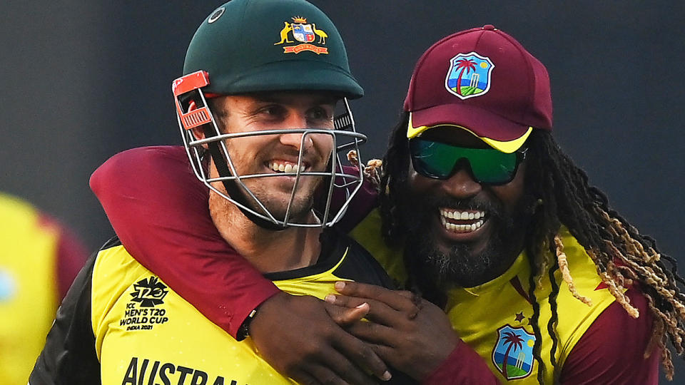 Mitch Marsh smiles as he is hugged by Chris Gayle, after the West Indian legend claimed his wicket at the T20 World Cup.