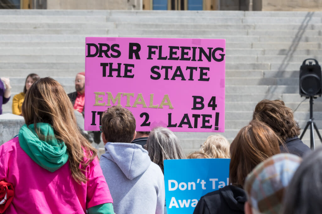 abortion rights activists at rally with signs