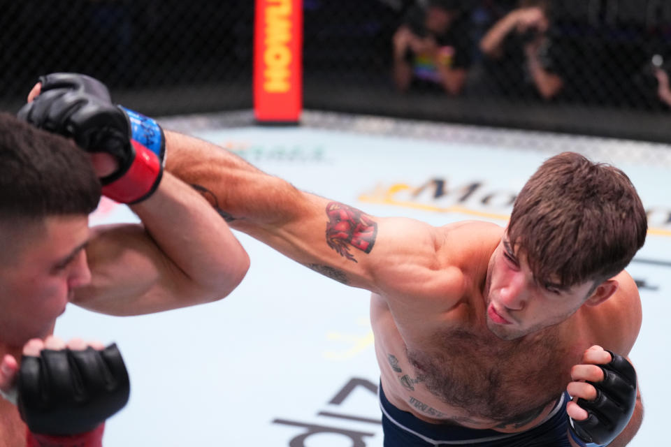 LAS VEGAS, NEVADA – AUGUST 02: (R-L) Billy Goff punches Shimon Smotritsky of Israel in a welterweight fight during Dana White’s Contender Series season six, week two at UFC APEX on August 02, 2022 in Las Vegas, Nevada. (Photo by Chris Unger/Zuffa LLC)