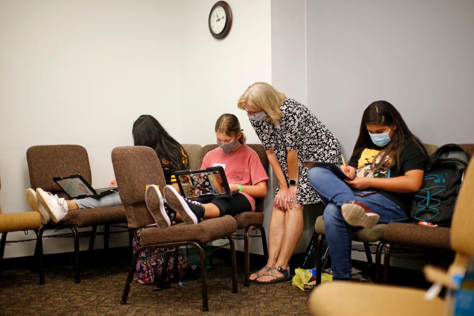 Children study on Aug. 26, 2020, inside Henderson Hills Baptist Church in Edmond. The church offered Edmond school students a place to go on Wednesdays to get homework help, use the free Wi-Fi for virtual learning, free lunch and other activities.