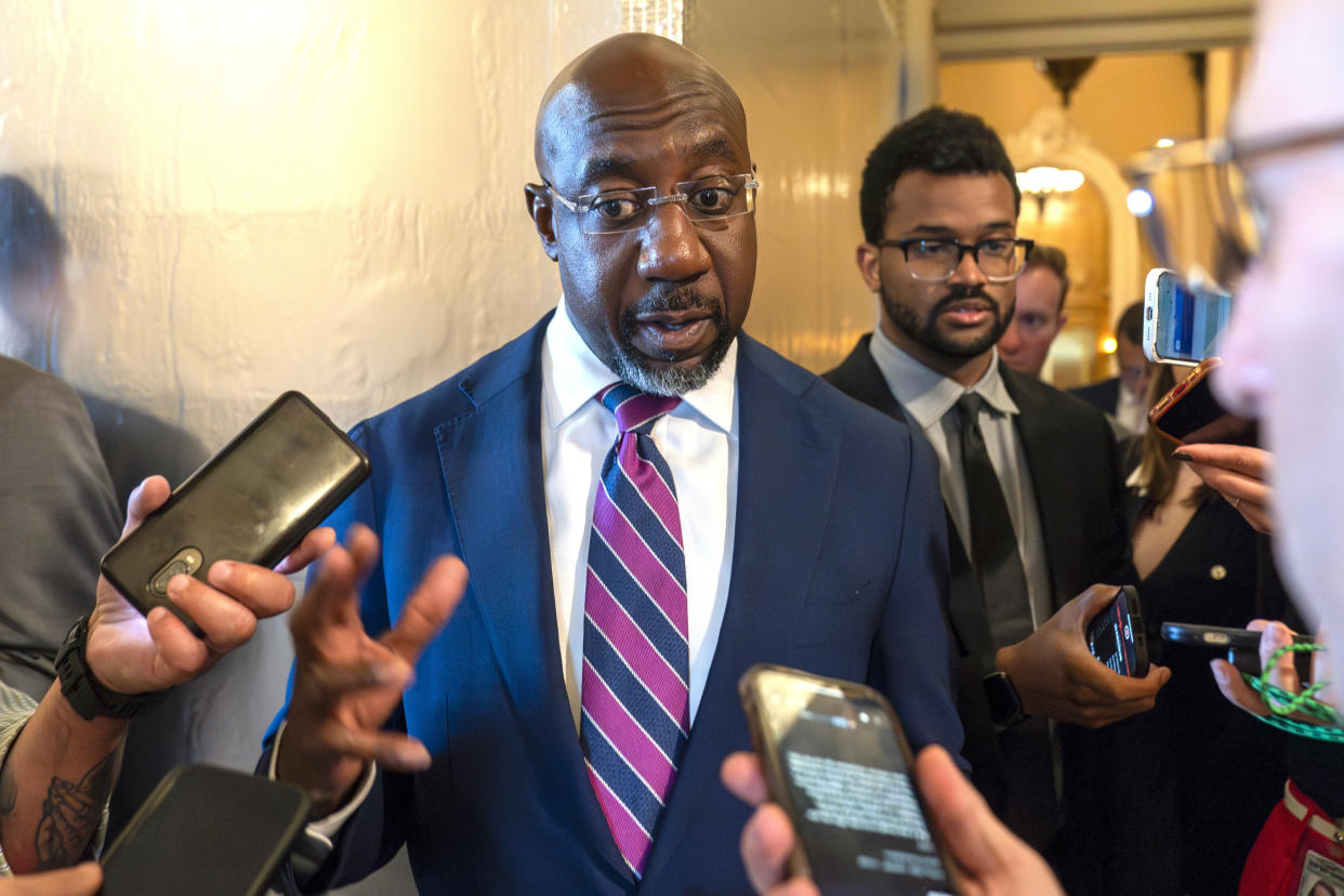 Georgia Sen. Raphael Warnock speaks with reporters in Washington, D.C., in 2023. 