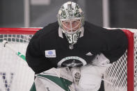 Dallas Stars goaltender Ben Bishop (30) defends the goal during an NHL hockey practice in Frisco, Texas, Thursday, Sept. 23, 2021. (AP Photo/LM Otero)