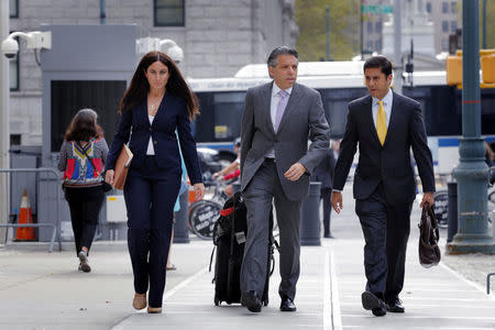 Aaron Davidson (2nd R), former president of the Miami-based unit of Brazilian sports marketing conglomerate Traffic Group, departs the Brooklyn Federal Courthouse after entering a guilty plea in the Brooklyn Borough of New York, U.S.,October 20, 2016. REUTERS/Lucas Jackson