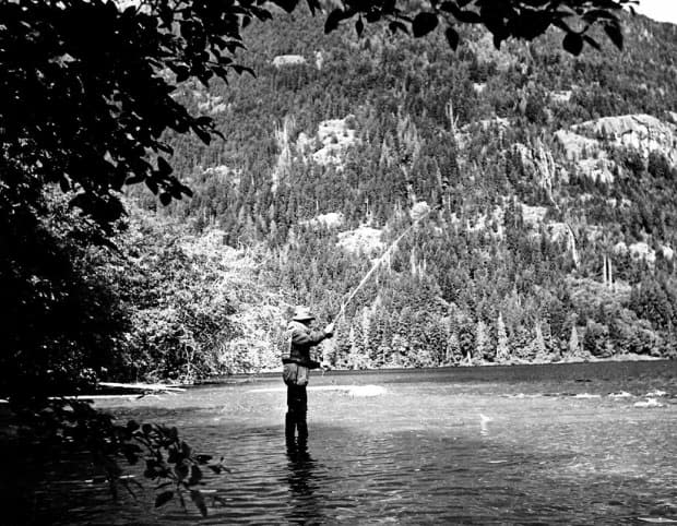 Will Reid fly fishing in the 1930s.