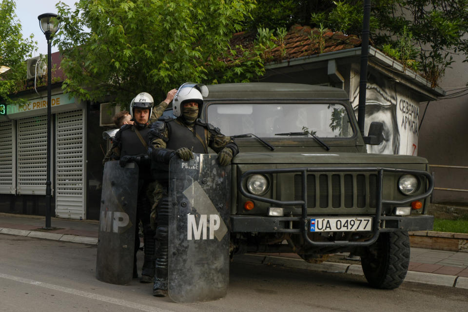 Polish soldiers, part of the peacekeeping mission in Kosovo KFOR guard street after Friday's violent clashes between Kosovo police and ethnic Serbs, in the town of Zvecan, northern Kosovo, Monday, May 29, 2023. Serbia condemned NATO-led peacekeepers stationed in neighboring Kosovo for their alleged failure to stop "brutal actions" by Kosovo police against ethnic Serbs, and said that its armed forces stationed near the border will remain on the highest state of alert until further notice. (AP Photo/Marjan Vucetic)
