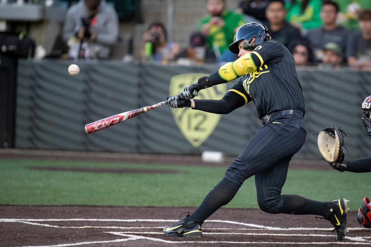 Oregon outfielder Bryce Boettcher hits a home run as the Oregon Ducks host the Oregon State Beavers Tuesday, April 30, 2024, at PK Park in Eugene, Ore.