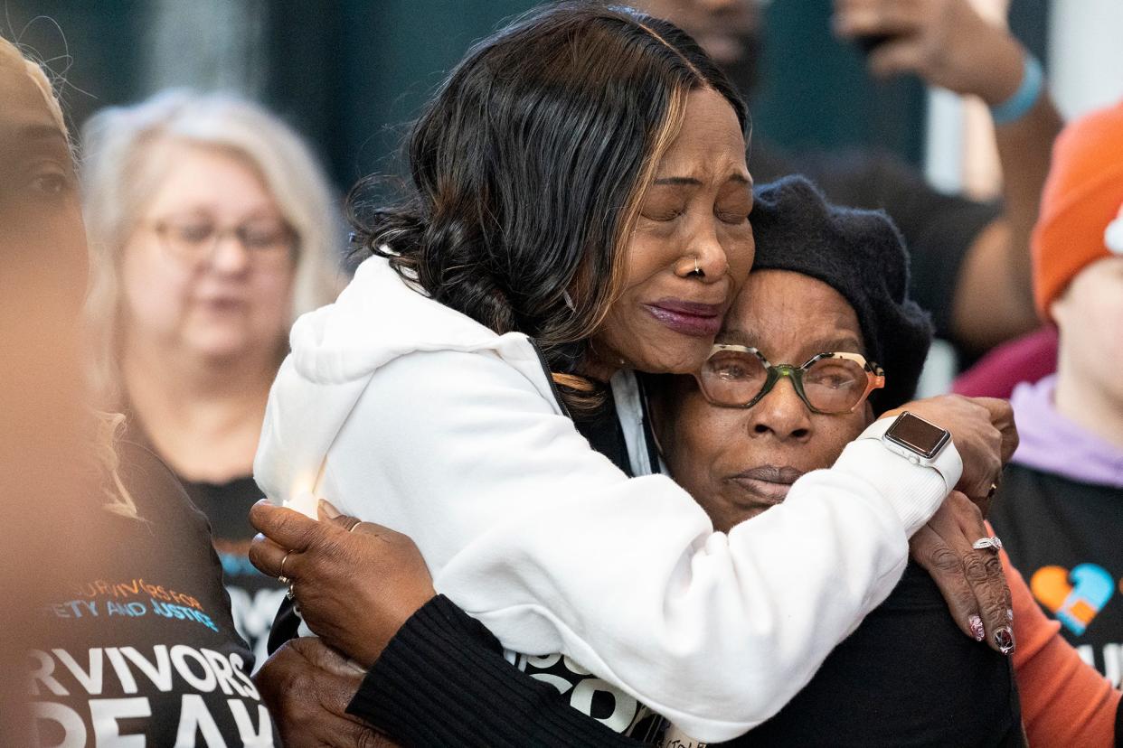 Carmel Villegas, left, and Landress Luckey, of Toledo, embrace during a survivors of crime event Wednesday at the Ohio Statehouse. Both of their daughters, who were best friends, were murdered.