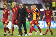 Spain's head coach Luis Enrique walks off the pitch with the players at the end of the World Cup group E soccer match between Spain and Germany, at the Al Bayt Stadium in Al Khor , Qatar, Sunday, Nov. 27, 2022. The match ended in a 1-1 draw. (AP Photo/Matthias Schrader)