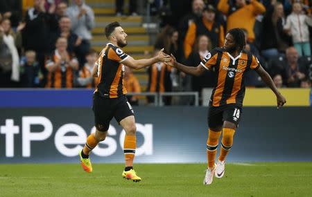 Football Soccer Britain - Hull City v Arsenal - Premier League - The Kingston Communications Stadium - 17/9/16 Hull City's Robert Snodgrass celebrates scoring their first goal with Dieumerci Mbokani Reuters / Russell Cheyne/ Livepic