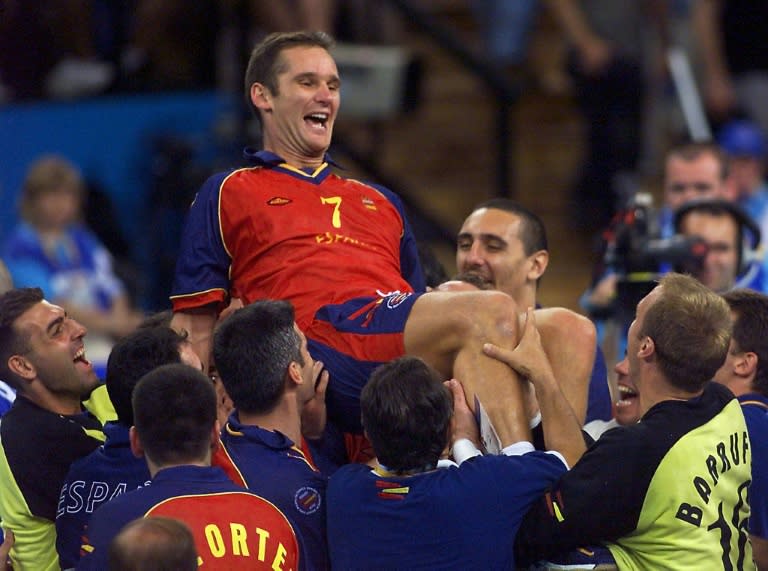 The Duke of Palma de Mallorca Inaki Urdangarin is lifted up by his teammates as they celebrate their 26-22 victory over Yugoslavia in the men's handball final for the bronze medal at the 2000 Sydney Olympic games