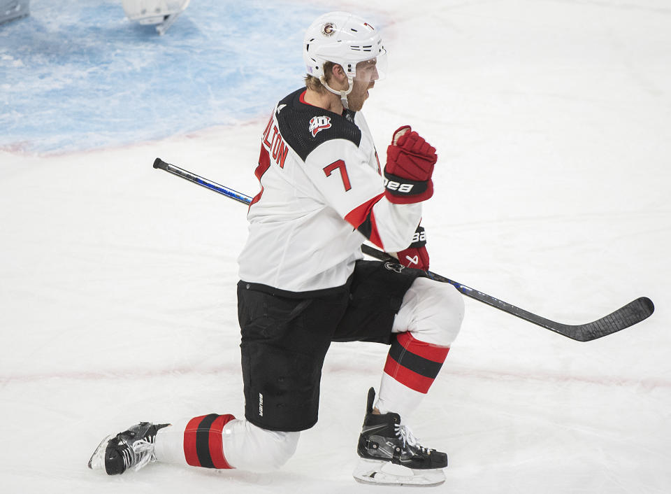 New Jersey Devils' Dougie Hamilton reacts after scoring against the Montreal Canadiens during the second period of an NHL hockey game, Tuesday, Nov. 15, 2022 in Montreal. (Graham Hughes/The Canadian Press via AP)