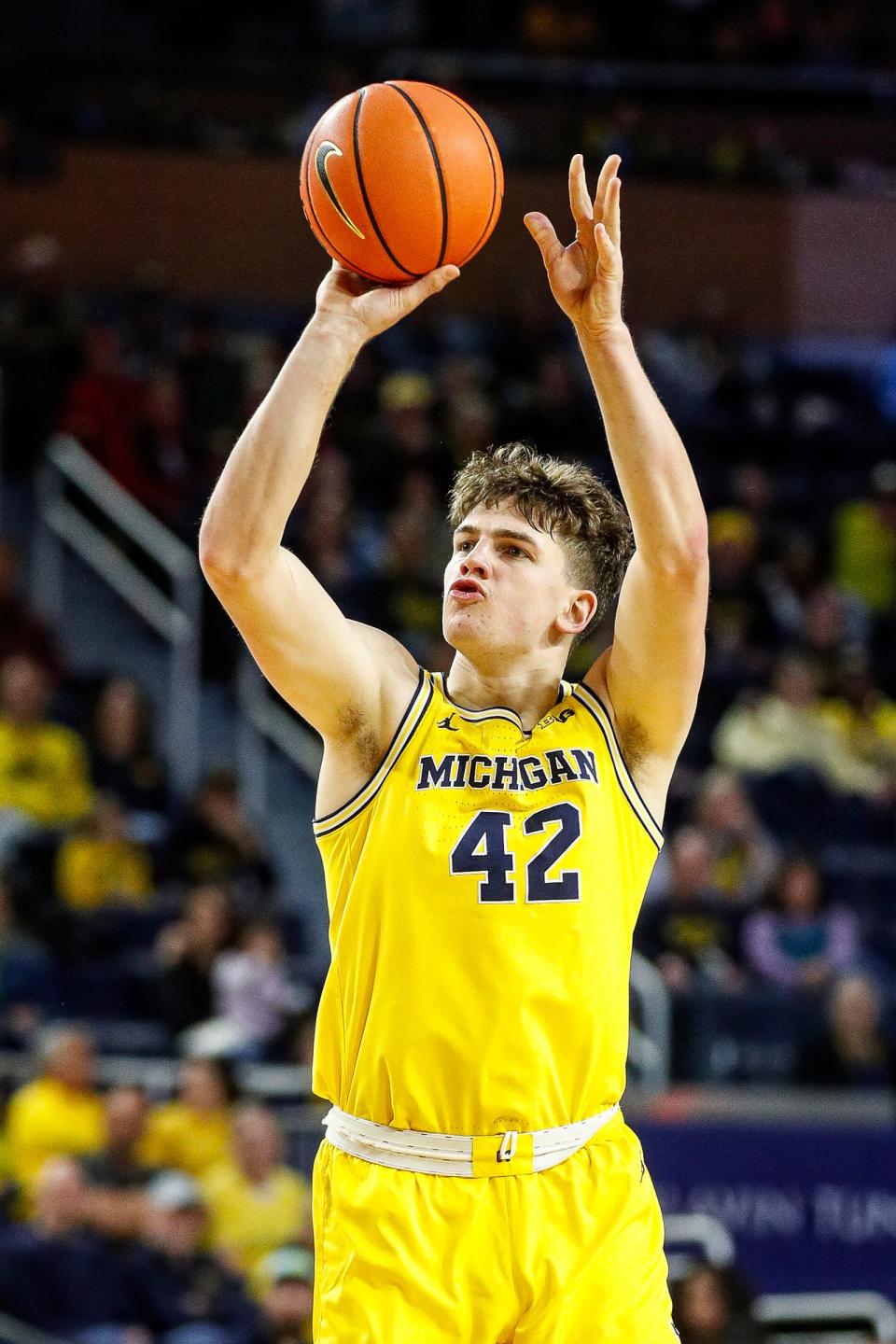 Michigan forward Will Tschetter (42) makes a jump shot against Nebraska during the first half at Crisler Center in Ann Arbor on Sunday, March 10, 2024.