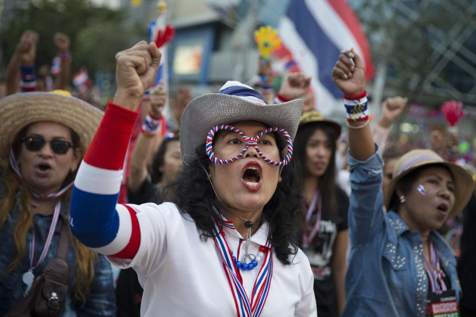 Anti-government People's Democratic Reform Committee protesters cheer at an encampment in the Pathumwan district, Thursday, Jan. 16, 2014, in Bangkok. Protesters were on the march again in the Thai capital Thursday, targeting government offices they have not previous interfered with to keep up pressure on Prime Minister Yingluck Shinawatra to resign and call off next month's election. (AP Photo/John Minchillo)