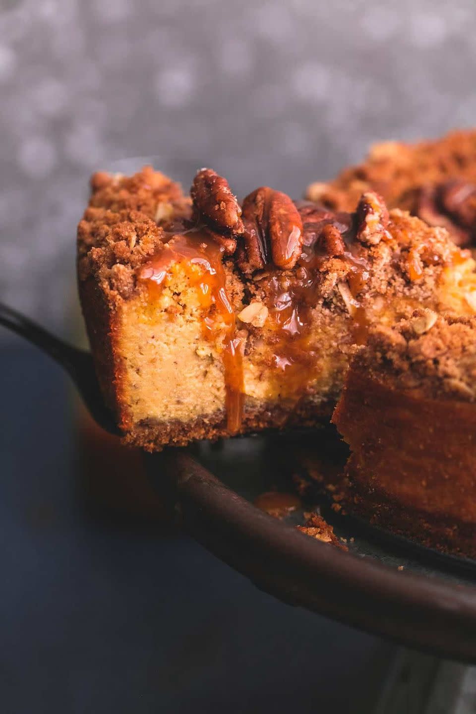 <p>Swap your pumpkin pie for this ooey, gooey cheesecake. Your guests will thank you!</p><p><strong>Get the recipe at <a href="https://www.lecremedelacrumb.com/caramel-pecan-pumpkin-cheesecake/" rel="nofollow noopener" target="_blank" data-ylk="slk:Creme de la Crumb;elm:context_link;itc:0;sec:content-canvas" class="link ">Creme de la Crumb</a>.</strong> </p>