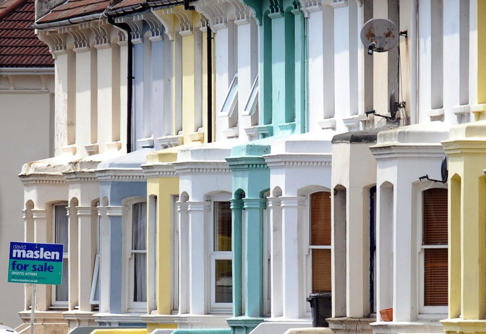 File photo dated 06/08/09 of a for sale sign outside houses in Brighton as the British love affair with home ownership is showing signs of cooling as many young people remain downbeat about their prospects of getting on the property ladder, a report has found.