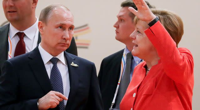 Footage from the G20 summit in Hamburg on Friday shows Ms Merkel stopped speaking with the Russian President. Photo: AAP