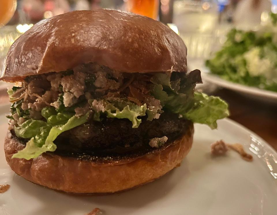 Every Tuesday, Goodkind's Burger Night gives chefs a chance to flex their creativity with a new special, like this Thai-Lao-inspired burger with pork laab, Thai chiles, peanut sauce and fried shallots.