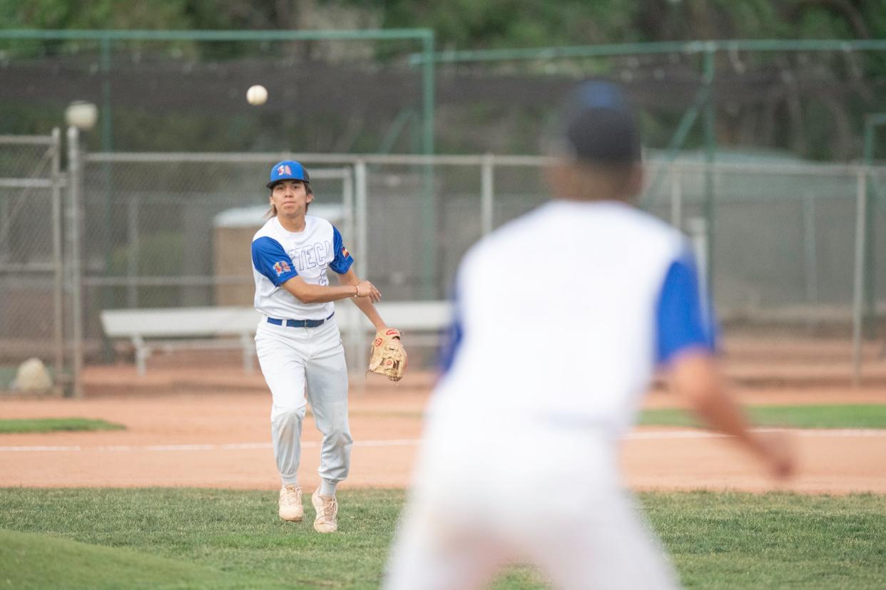 Pueblo Azteca's Matt Casillas throws to first for an out during a game against Greeley GoJo on the first day of the 42nd annual Andenucio Memorial Baseball Tournament on Thursday, June 16, 2022.