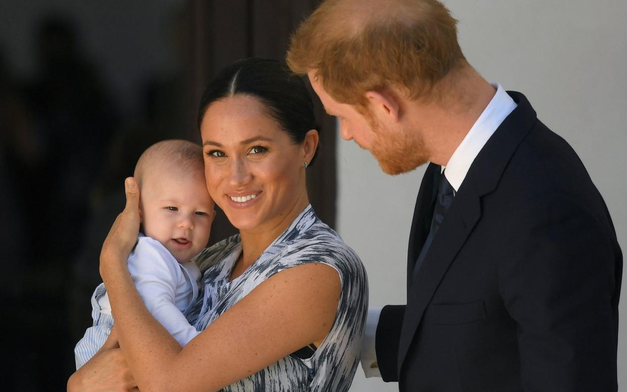 The images showed the Duchess walking with her son in a baby sling, and her two dogs, in Horth Hill Regional Park on Vancouver island - PA