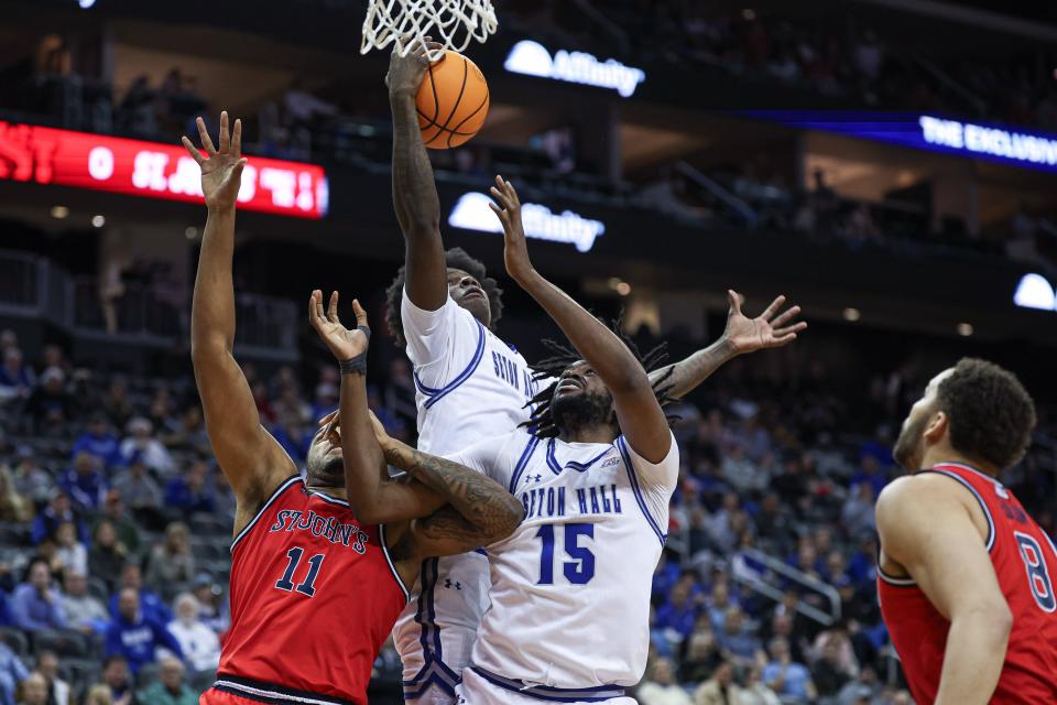 Jan 16, 2024; Newark, New Jersey, USA; Seton Hall Pirates guard Kadary Richmond (1) and center Jaden Bediako (15) rebound against St. John's Red Storm center Joel Soriano (11) during the first half at Prudential Center. Mandatory Credit: Vincent Carchietta-USA TODAY Sports