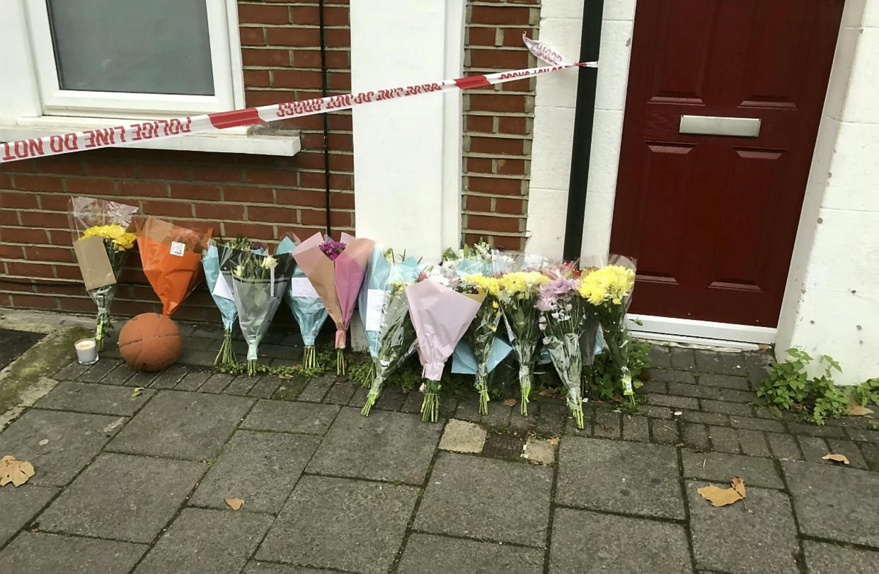 Foral tributes were left at the scene in Brentford. (SWNS)