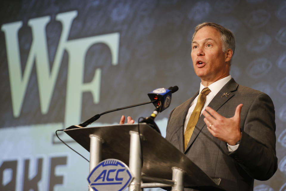 FILE - Wake Forest head coach Dave Clawson answers a question at the NCAA college football Atlantic Coast Conference Media Days in Charlotte, N.C., Wednesday, July 20, 2022. “You used to talk about graduation rates and majors,” Clawson said about recuiting. “Now the first question is, ‘What are you guaranteeing me year one, two, three and four?’” Clawson isn't necessarily talking about playing time, either. Prospects are far more familiar with ways they can profit off their fame through endorsement deals and are looking hard at whether schools can help them do it. (AP Photo/Nell Redmond, File)