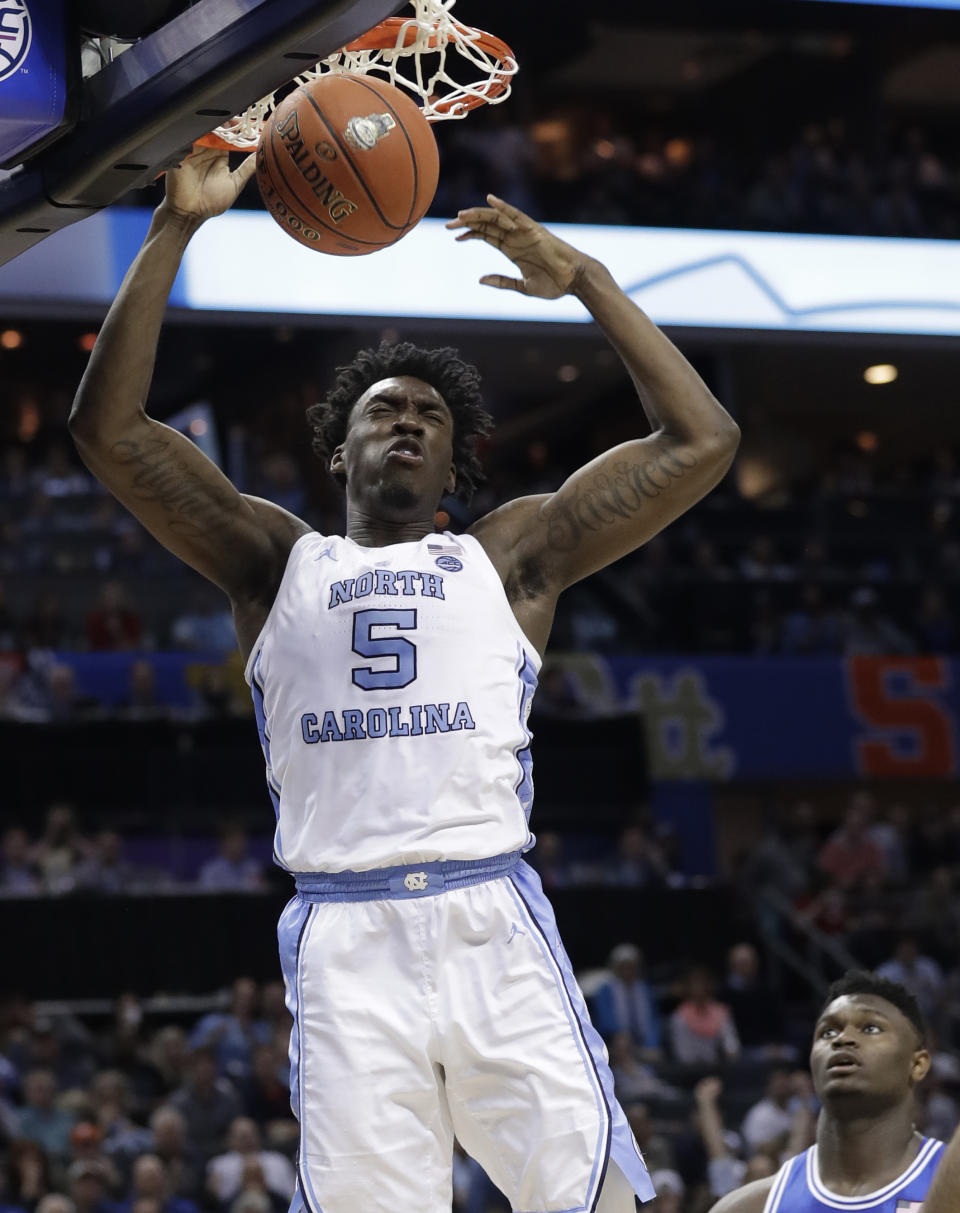 FILE - In this March 15, 2019, file photo, North Carolina's Nassir Little (5) dunks against Duke during the second half of an NCAA college basketball game in the Atlantic Coast Conference tournament, in Charlotte, N.C. Little is one of the top forwards in the NBA Draft on Thursday, June 20. (AP Photo/Chuck Burton, File)