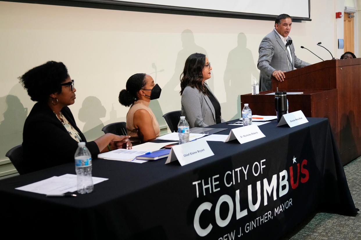 Columbus Mayor Andrew J. Ginther speaks Tuesday, Sept. 19, 2023, during a community forum with the public about gun violence held at Columbus Public Health on Parsons Avenue.  Seated, from right to left, are Rena Shak, director of the city Office of Violence Prevention; Dr. Mysheika W. Roberts, city health commissioner, and Columbus police Chief Elaine Bryant.