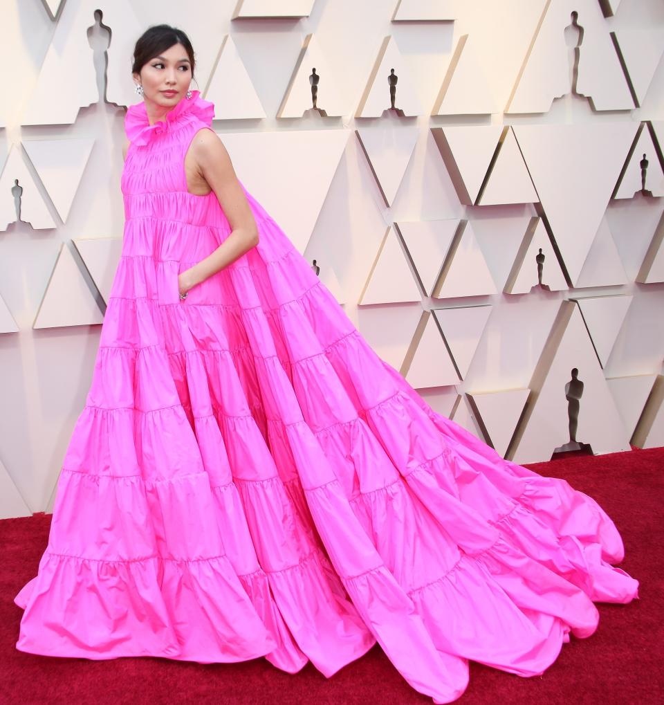 Gemma wearing an elegant bright pink gown