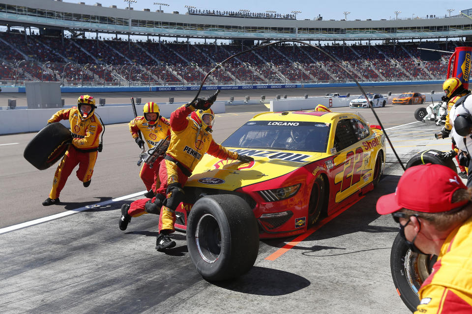 Joey Logano makes a pit stop for fuel and tires on lap 79 during a NASCAR Cup Series auto race at Phoenix Raceway, Sunday, March 14, 2021, in Avondale, Ariz. (AP Photo/Ralph Freso)