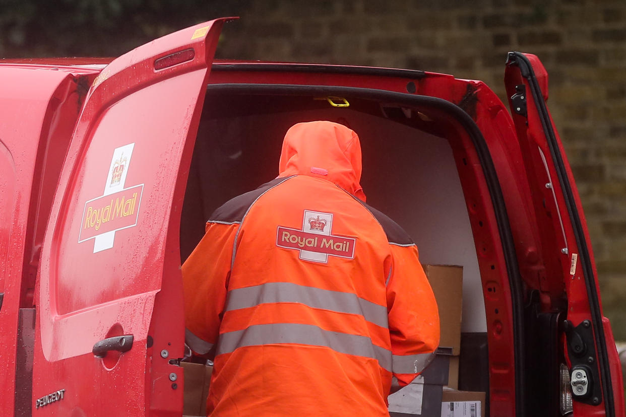 A Royal Mail postal worker preparers to deliver the mail at his van in London. According to Royal Mail, some areas of London have seen a reduced service as postal workers being off sick or self-isolating due to the Covid-19 pandemic. (Photo by Steve Taylor / SOPA Images/Sipa USA)