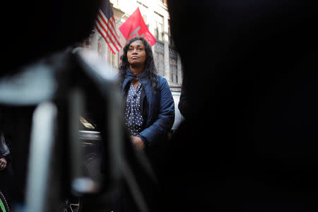 Tamara Lanier listens as her lawyer speaks to the media about a lawsuit accusing Harvard University of the monetization of photographic images of her great-great-great grandfather, an enslaved African man named Renty, and his daughter Delia outside of the Harvard Club in New York, U.S., March 20, 2019. REUTERS/Lucas Jackson