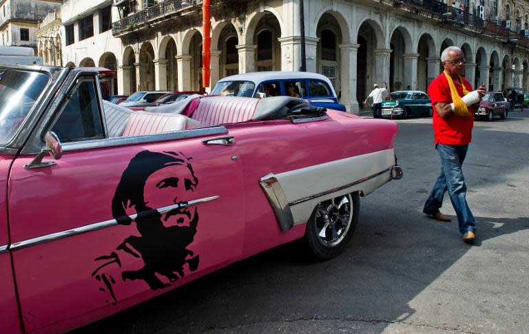 An old American car with an image of former Cuban President Fidel Castro in Havana, on January 19, 2015