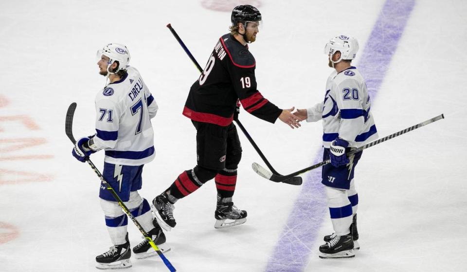 Carolina Hurricanes Dougie Hamilton (19) shakes hands with Tampa Bay’s Blake Coleman (20) after the Lightning clinched their series against the Hurricanes with a 2-0 victory in game five on Tuesday, June 8, 2021 at PNC Arena in Raleigh, N.C.