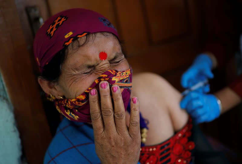 The Wider Image: Doctors scale rockslides, invoke gods to vaccinate Himalayan villages