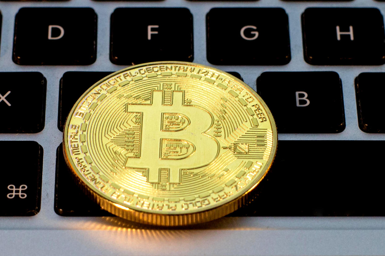 SPAIN - 2021/02/23: In this photo illustration, a Bitcoin is seen on the background of a computer keyboard. (Photo Illustration by Thiago Prudêncio/SOPA Images/LightRocket via Getty Images)