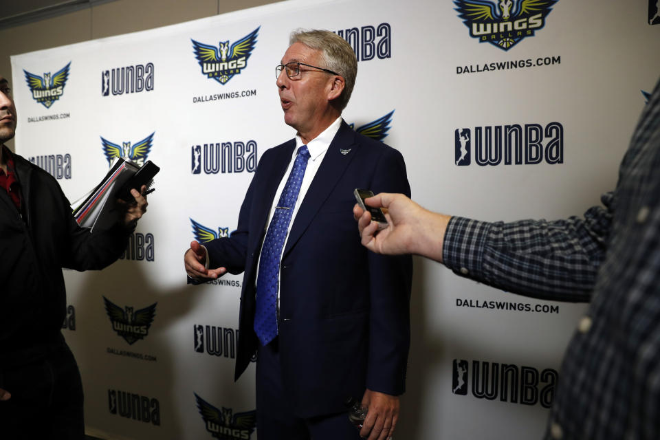 Newly hired WNBA's Dallas Wings head coach Brian Agler responds to questions from reporters after a news conference where Agler was officially introduced, Tuesday, Dec. 18, 2018, in Arlington, Texas. (AP Photo/Tony Gutierrez)