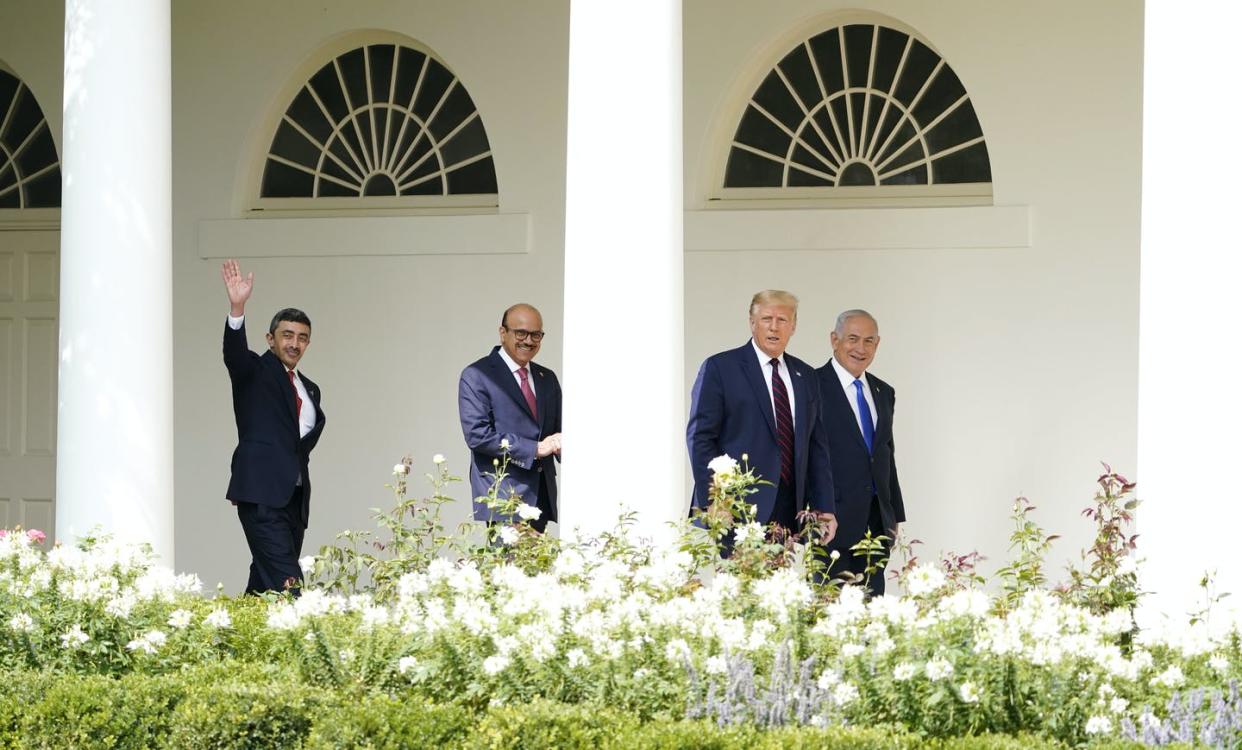 <span class="caption">U.S. President Donald Trump walks to the Abraham Accords signing ceremony at the White House on Sept. 15, 2020, with Israeli Prime Minister Benjamin Netanyahu, Bahrain Foreign Minister Khalid bin Ahmed Al Khalifa and United Arab Emirates Foreign Minister Abdullah bin Zayed al-Nahyan.</span> <span class="attribution"><span class="source">(AP Photo/Alex Brandon)</span></span>