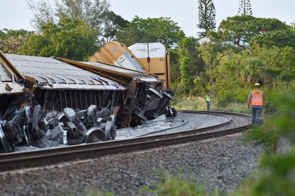 A Florida East Coast Railway freight train derailed at the east end of Northeast Clarissa Street on Thursday, May 19, 2022, in Jensen Beach. Five train cars toppled and three more came off the tracks, said Martin County Fire Rescue District Chief Joshua Shell.