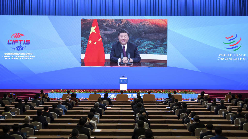 In this photo released by Xinhua News Agency, Chinese President Xi Jinping addresses the Global Trade in Services Summit of the 2020 China International Fair for Trade in Services (CIFTIS) via video in Beijing, China on Friday, Sept. 4, 2020. Chinese President Xi Jinping said China will further open to the outside world at the opening ceremony of a massive trade fair in Beijing, the first this large scale trade event integrating online and offline exchanges since the coronavirus outbreak. (Li Tao/Xinhua via AP)