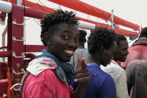 A migrant boarding the Ocean Viking rescue ship, which picked up more than 80 migrants off the Libya coast on Saturday