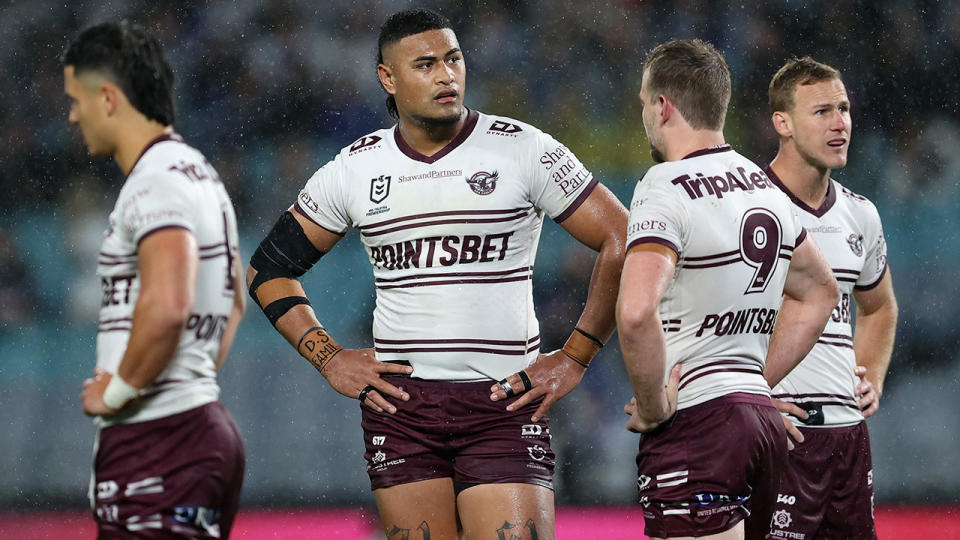 Manly players react with dismay during their round 24 loss to the Bulldogs.