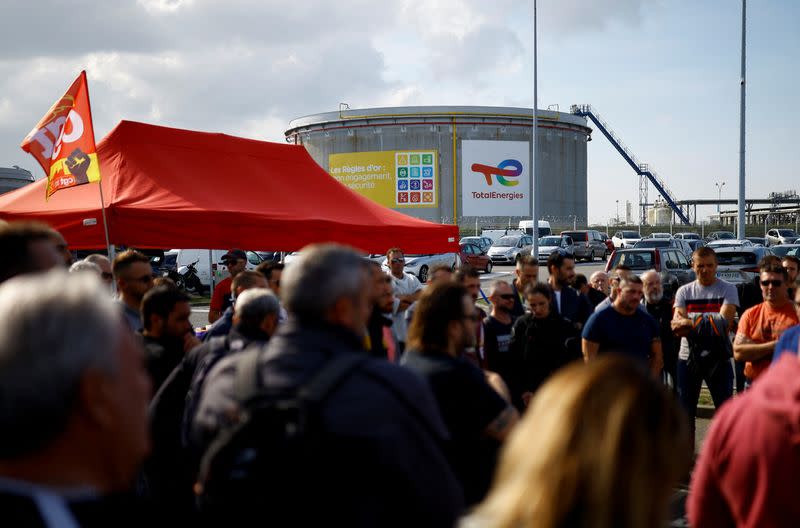 Workers on strike gather in front of the French oil giant TotalEnergies refinery in Donges