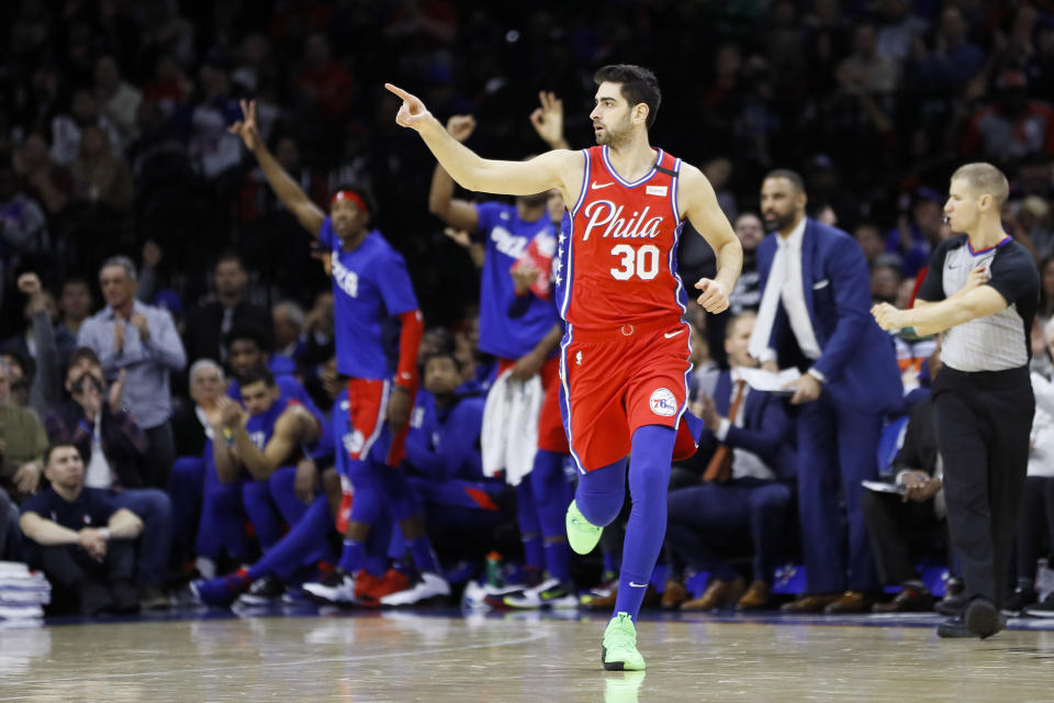 Philadelphia's Furkan Korkmaz had one more teammate than usual to thank for a 3-pointer. (AP Photo/Matt Slocum)